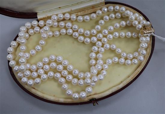 A triple strand cultured pearl choker necklace with yellow metal clasp, 42cm.